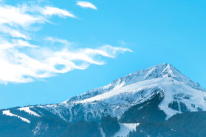 Vibrant travel ski background with, slopes, snow mountain peak, copyspace